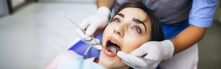 doctor checking teeth